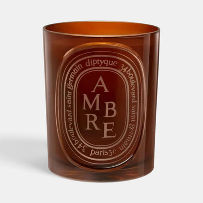 Shop Rescue Spa Diptyque Ambre scented candle in a translucent amber glass vessel with signature oval label