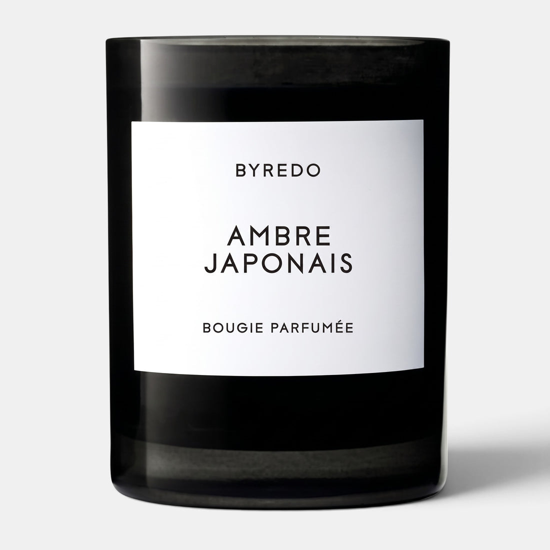 Shop Rescue Spa Ambre Japonais scented candle in a black glass jar with a white minimalist label.