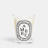 Shop Rescue Spa Ambre woody scented candle in a clear glass jar with a signature oval label