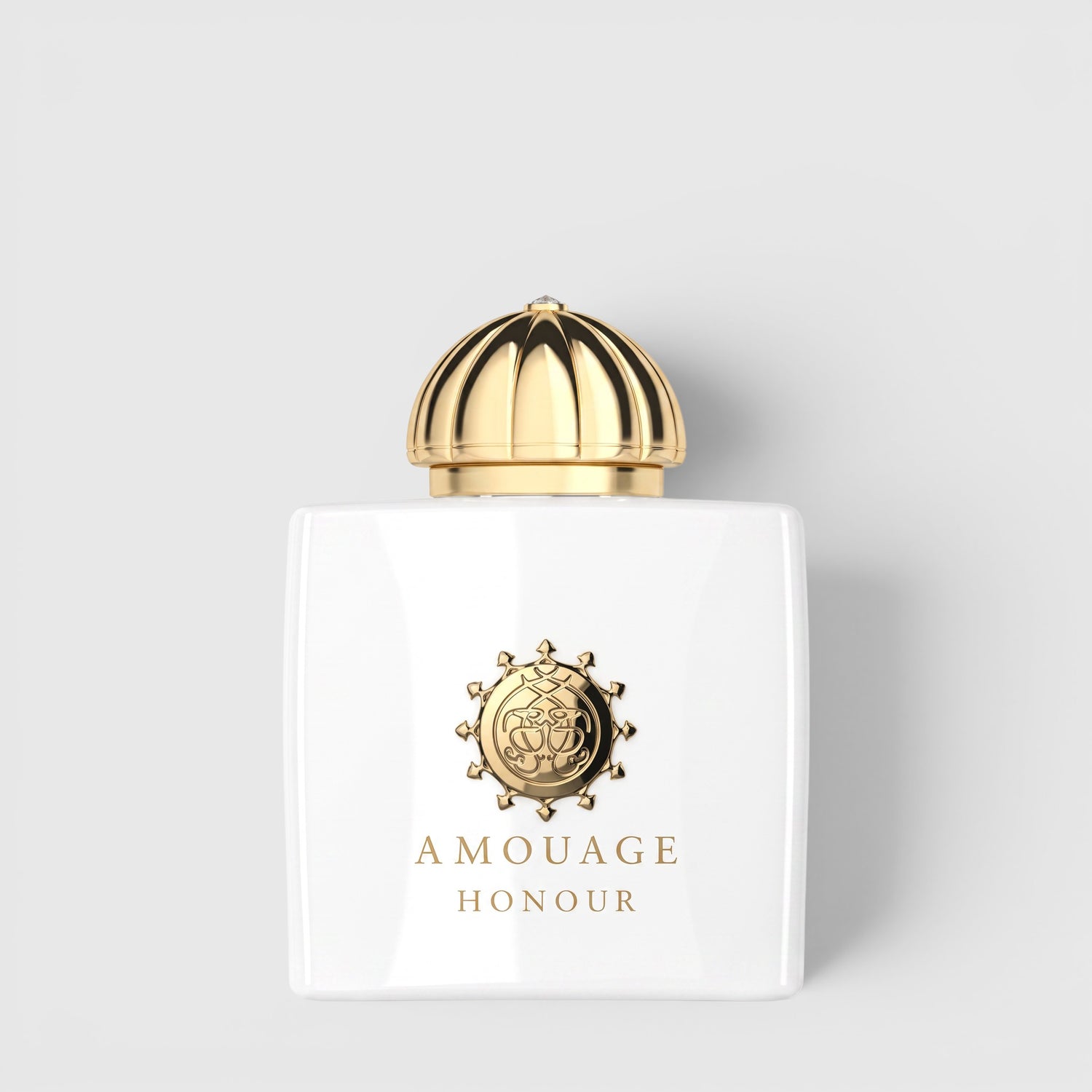 Shop Rescue Spa Amage Honour Eau De Parfum in a white glass bottle with a gold dome cap and embossed gold logo.