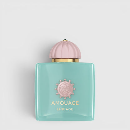 Shop Rescue Spa Amouage Lineage Eau De Parfum in a square turquoise glass bottle with a pale pink dome cap.