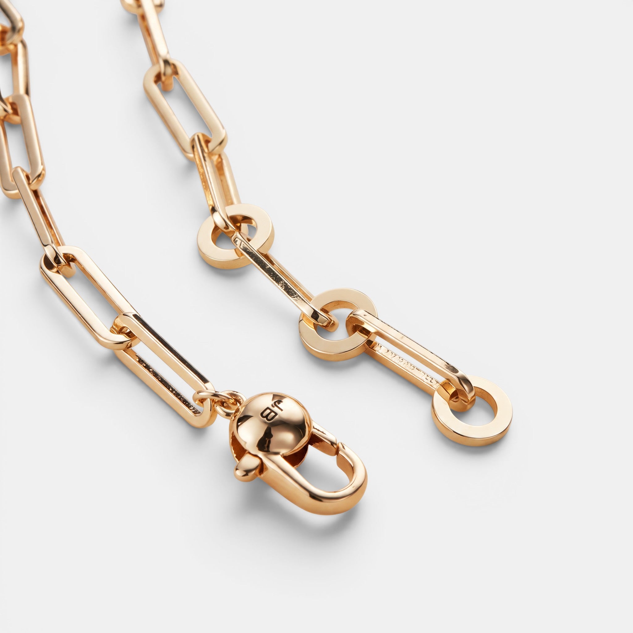 Shop Rescue Spa Andi Slim Chain paperclip necklace in high-polish gold tone brass with a lobster clasp closure.