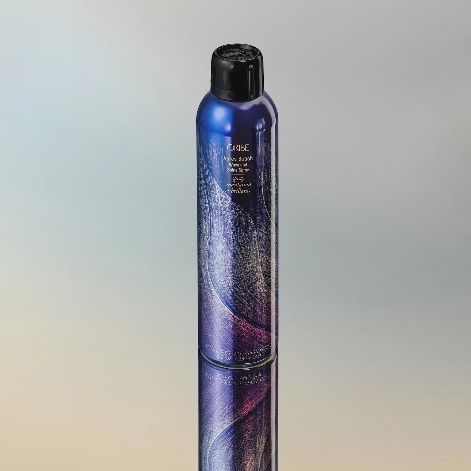 Shop Rescue Spa ORIBE Apres Beach Wave and Shine Spray bottle with a blue, purple, and gold swirled design.