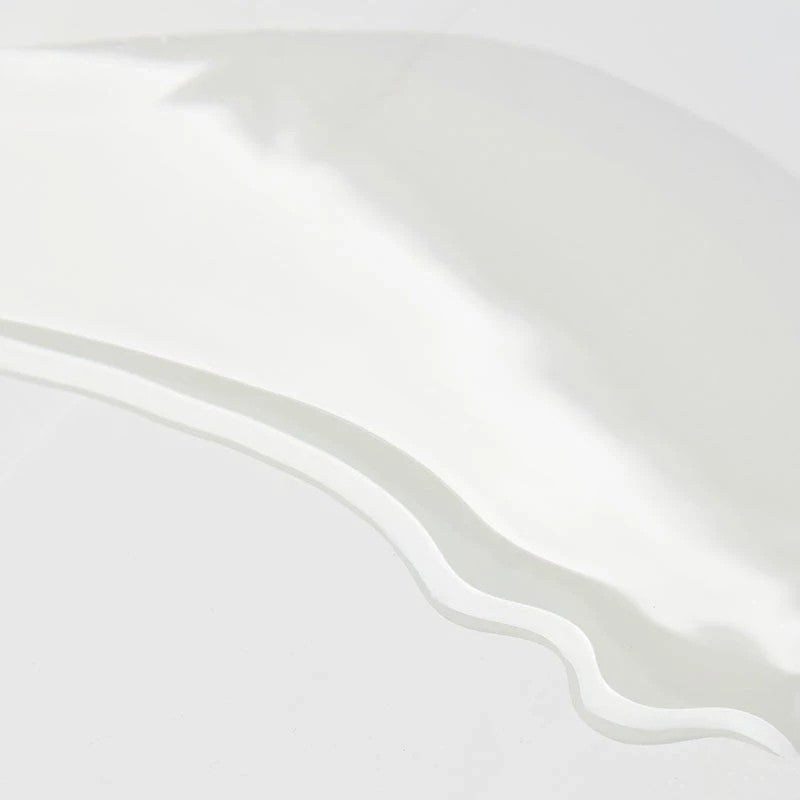 Shop Rescue Spa Augustinus Bader The Body Oil texture swatch showing a clear, lightweight, and silky oil consistency.