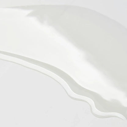 Shop Rescue Spa Augustinus Bader The Body Oil texture swatch showing a clear, lightweight, and silky oil consistency.