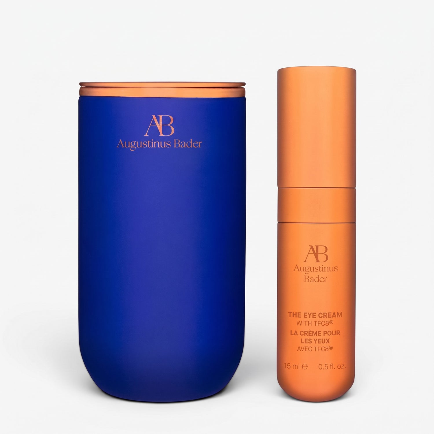 Shop Rescue Spa Augustinus Bader The Eye Cream in a blue container with a copper-toned pump bottle on a white background