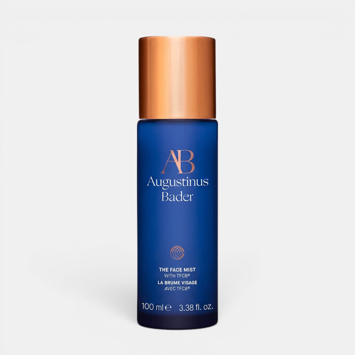 Shop Rescue Spa Augustinus Bader The Face Mist in a blue bottle with a metallic copper cap for hydrating skin.