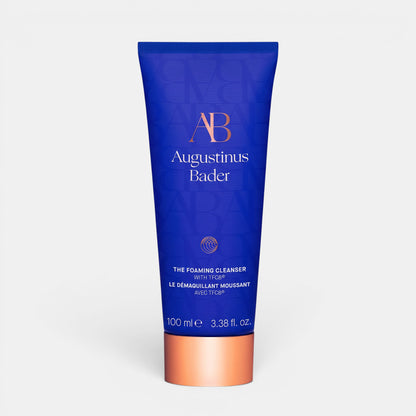 Shop Rescue Spa Augustinus Bader The Foaming Cleanser in a blue tube with copper cap for purifying and makeup removal.