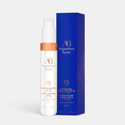 Shop Rescue Spa Augustinus Bader The Mineral Sunscreen SPF 50 in a white pump bottle with its blue product box.