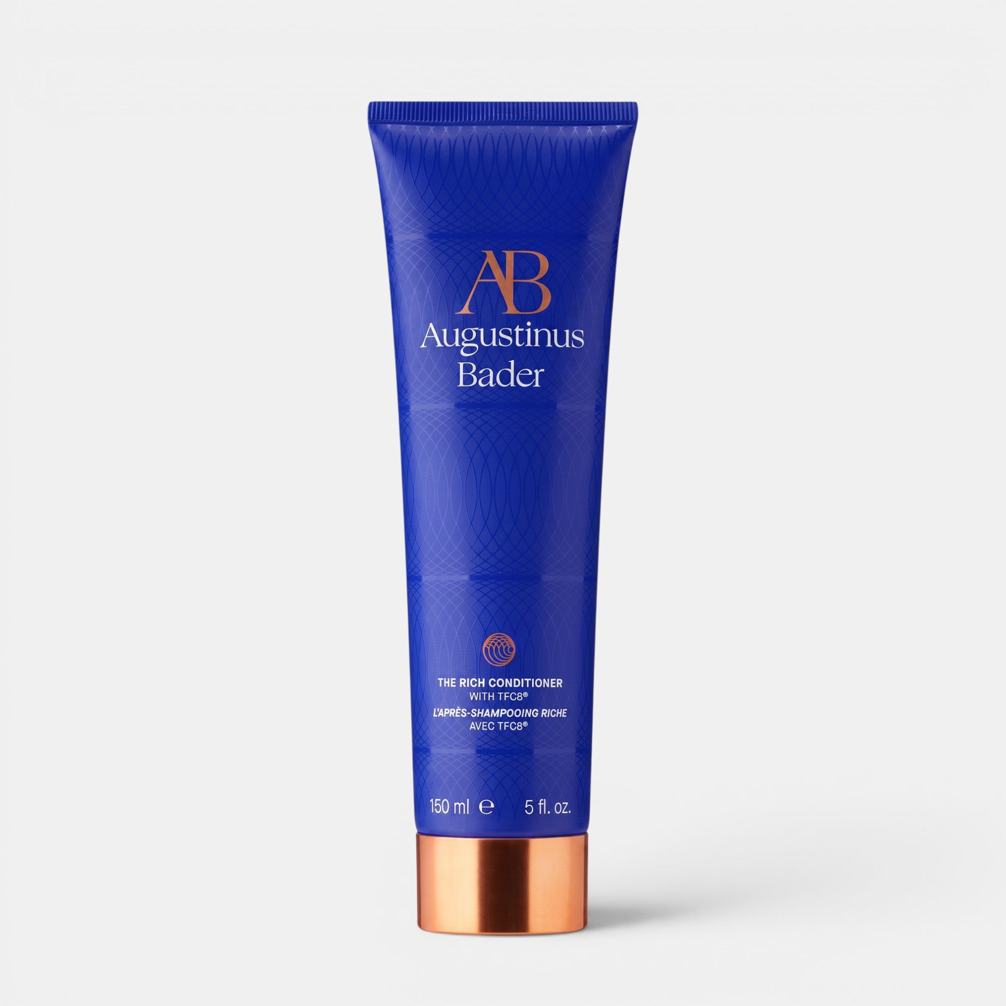 Shop Rescue Spa Augustinus Bader The Rich Conditioner in a blue 150ml tube with a metallic copper cap.