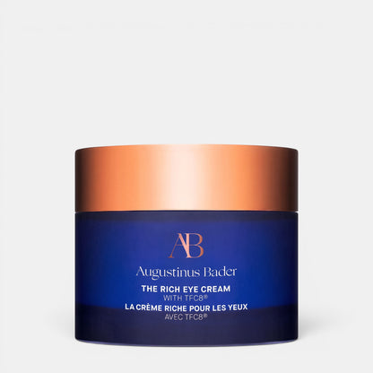 Shop Rescue Spa Augustinus Bader The Rich Eye Cream in a deep blue glass jar with a metallic copper lid.