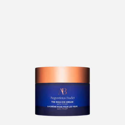Shop Rescue Spa Augustinus Bader The Rich Eye Cream in a deep blue glass jar with a metallic copper lid.
