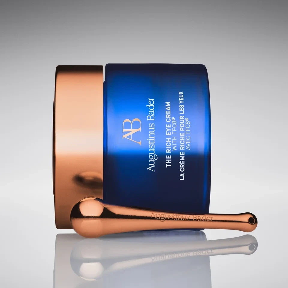 Shop Rescue Spa Augustinus Bader The Rich Eye Cream in a blue jar with a rose gold lid and cooling massage tool