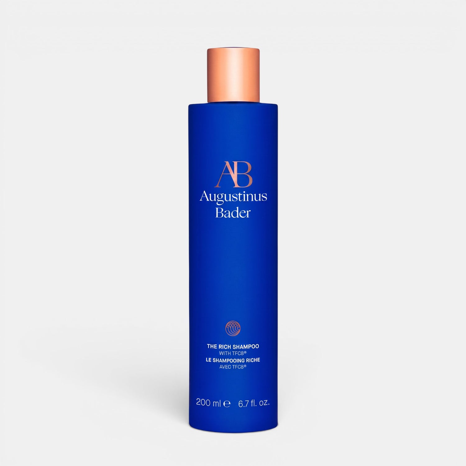 Shop Rescue Spa Augustinus Bader The Rich Shampoo in a blue bottle with a metallic cap for nourishing dry hair.