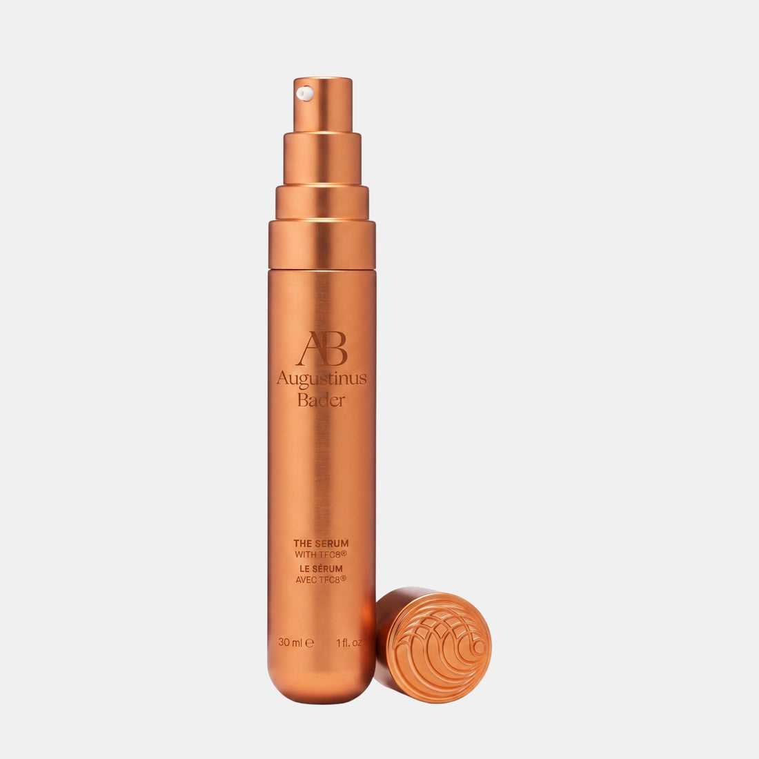 Shop Rescue Spa Augustinus Bader The Serum Nomad 30ml in a metallic copper pump bottle with a matching cap.
