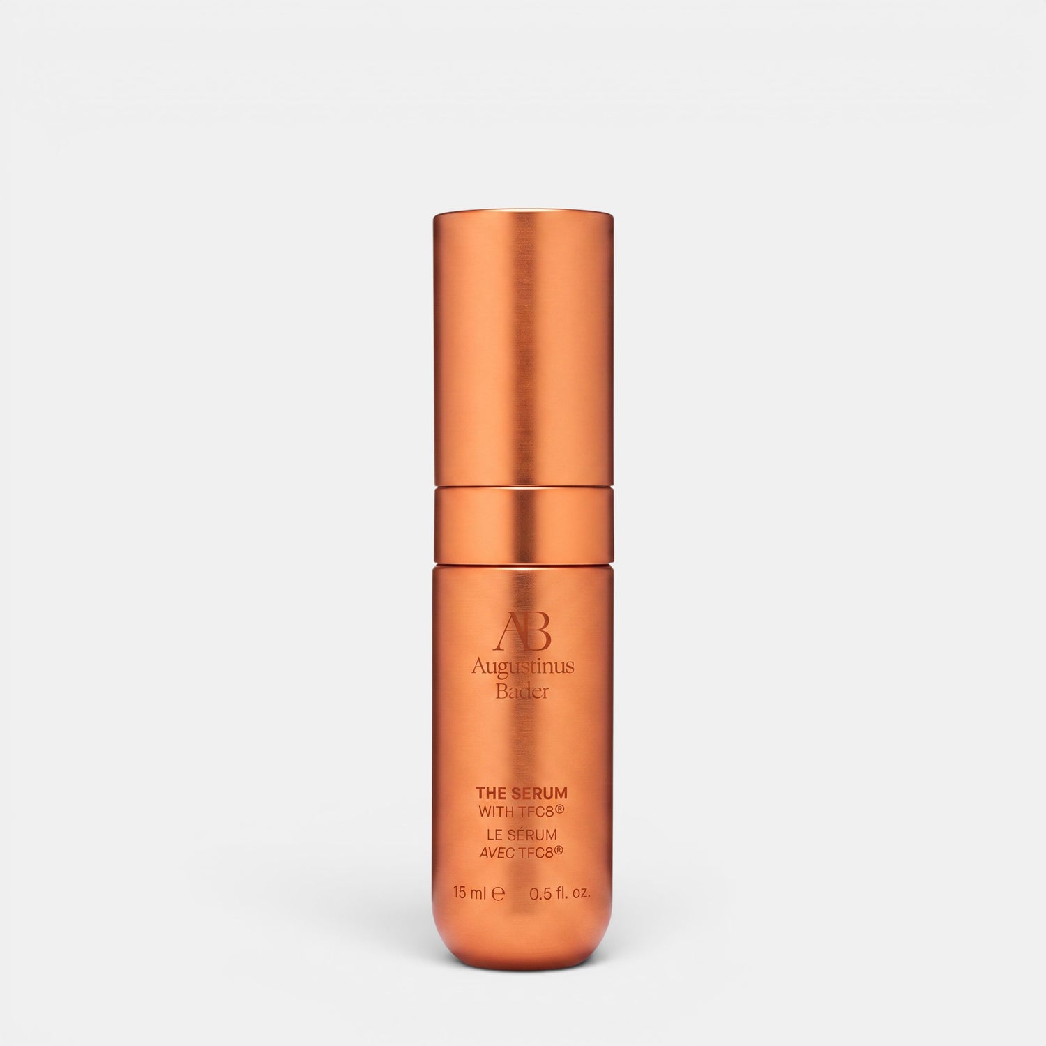 Shop Rescue Spa Augustinus Bader The Serum Nomad 15ml in a metallic copper cylindrical bottle for skin rejuvenation.