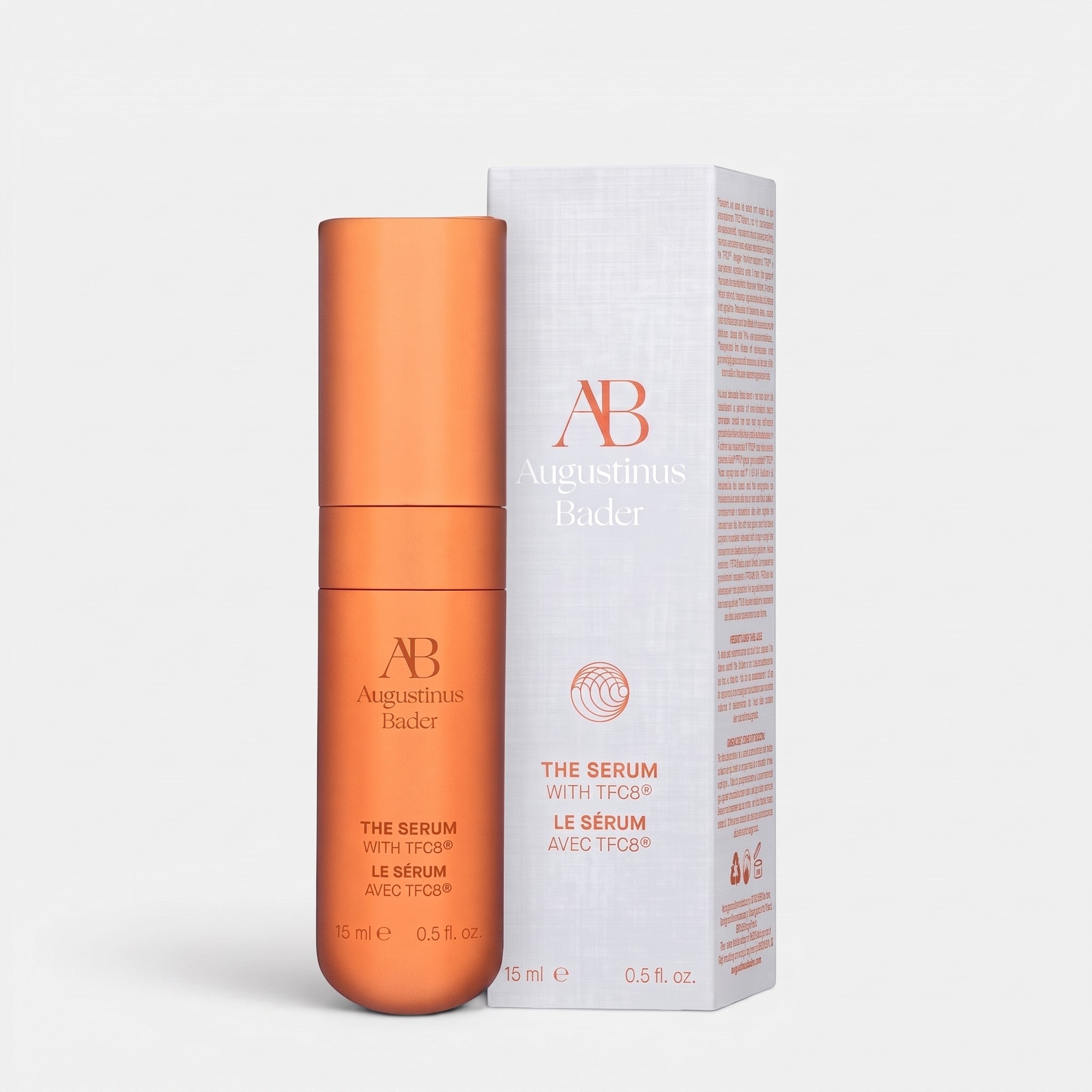Shop Rescue Spa Augustinus Bader The Serum Nomad 15ml in a metallic orange bottle with its matching white product box.