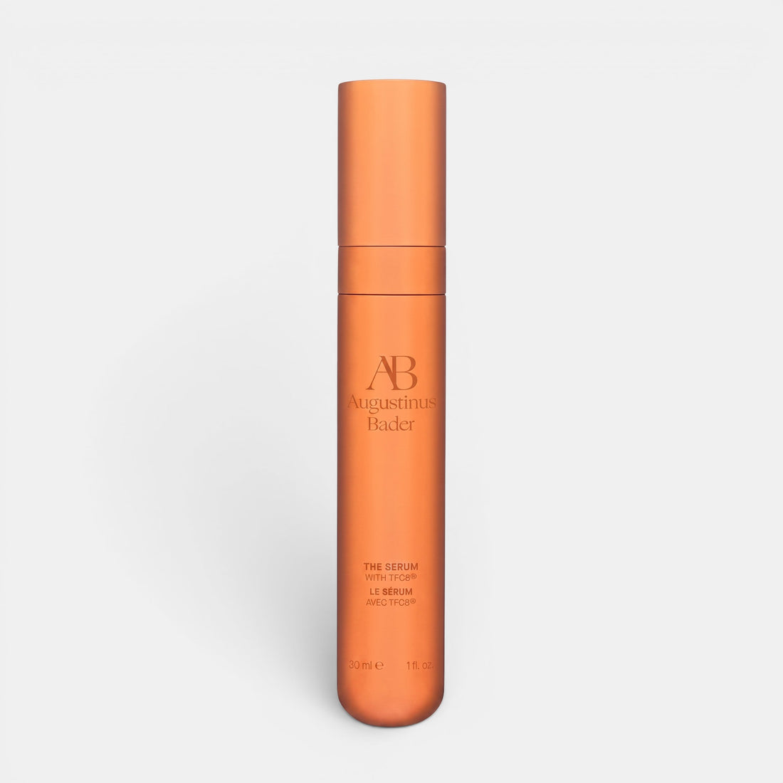 Shop Rescue Spa Augustinus Bader The Serum Nomad 30ml in a sleek metallic copper cylindrical bottle.