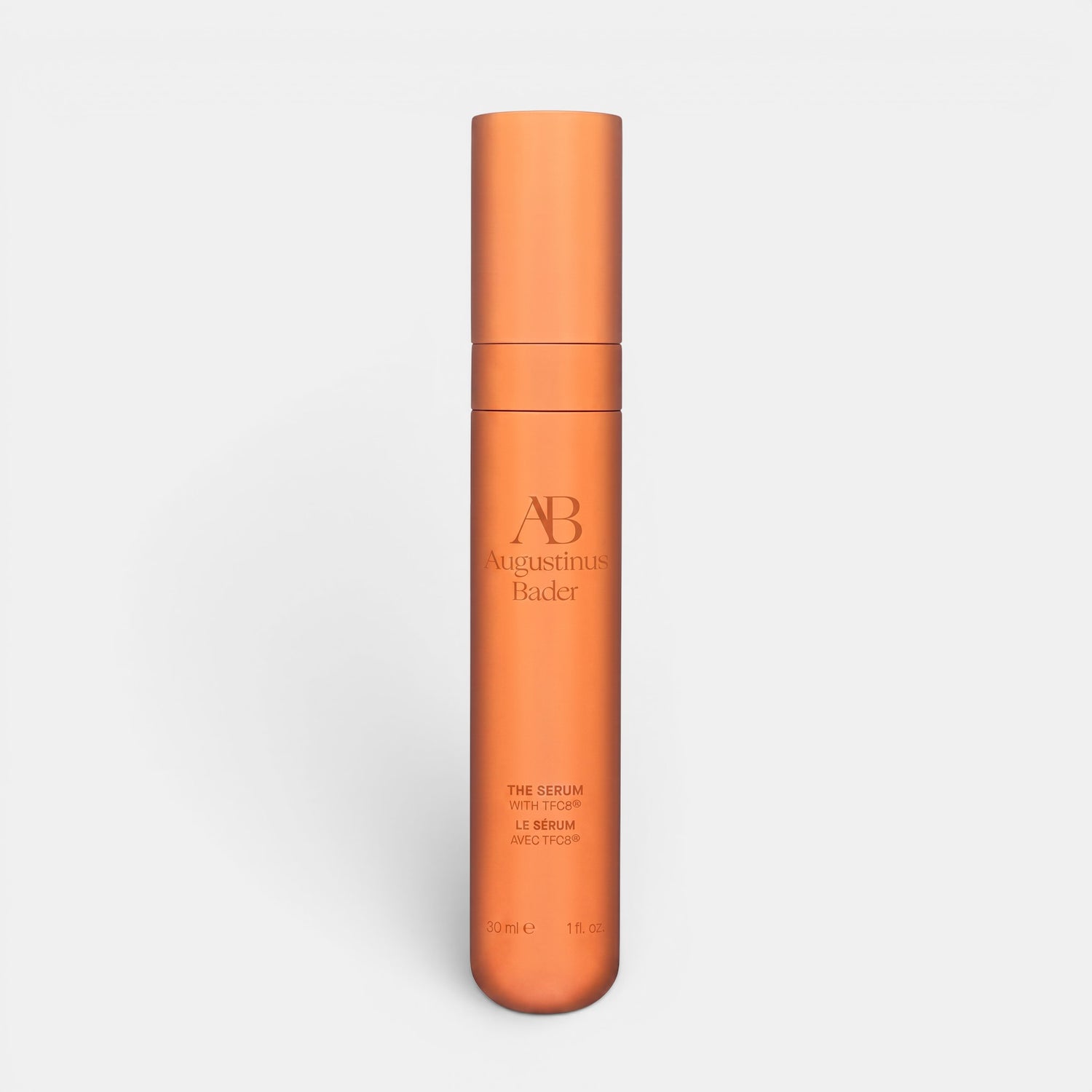 Shop Rescue Spa Augustinus Bader The Serum Nomad 30ml in a sleek metallic copper cylindrical bottle.