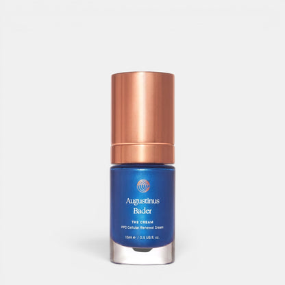 Shop Rescue Spa Augustinus Bader The Cream in a blue bottle with a metallic cap for cellular skin renewal.