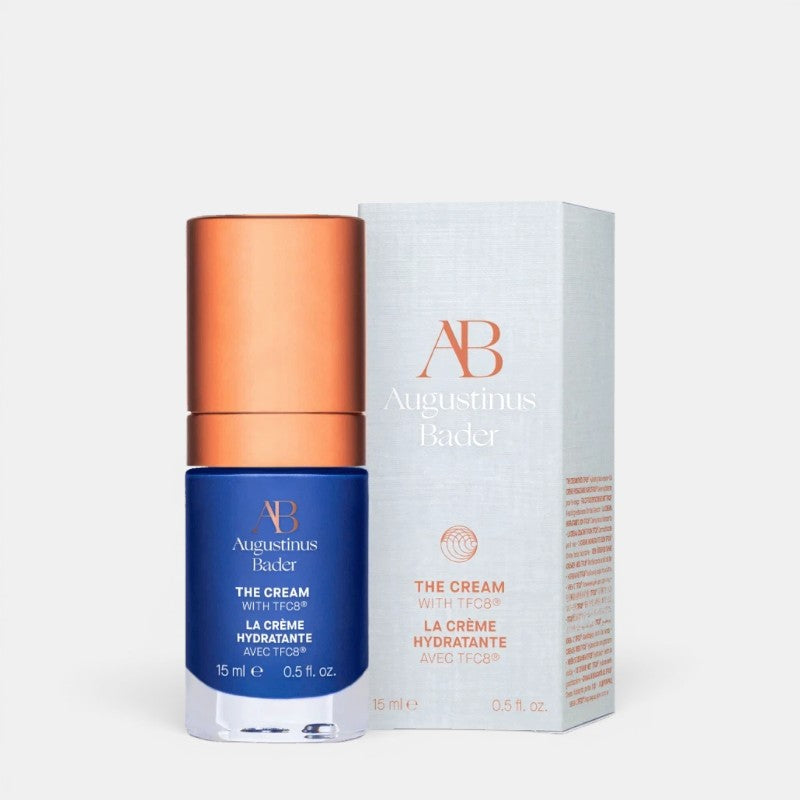 Shop Rescue Spa Augustinus Bader The Cream moisturizer in a blue bottle with copper cap and matching product box.