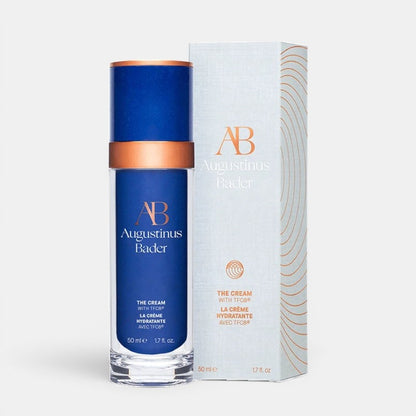 Shop Rescue Spa Augustinus Bader The Cream moisturizer in a blue bottle with its white and copper product box.