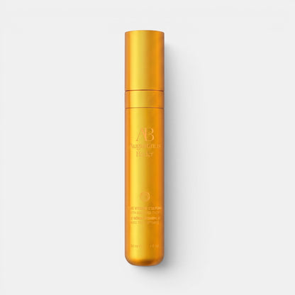 Shop Rescue Spa Augustinus Bader Vitamin C Serum in a sleek gold cylindrical bottle for skin brightening and renewal.