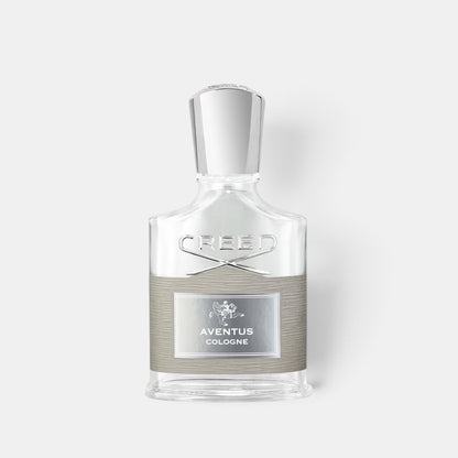 Shop Rescue Spa Aventus Cologne fragrance bottle with a clear glass design, silver cap, and grey textured label.