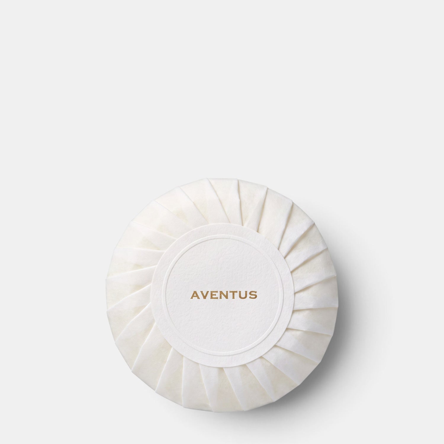 Shop Rescue Spa Aventus perfumed body soap in a round, white pleated paper wrapper with gold branding.