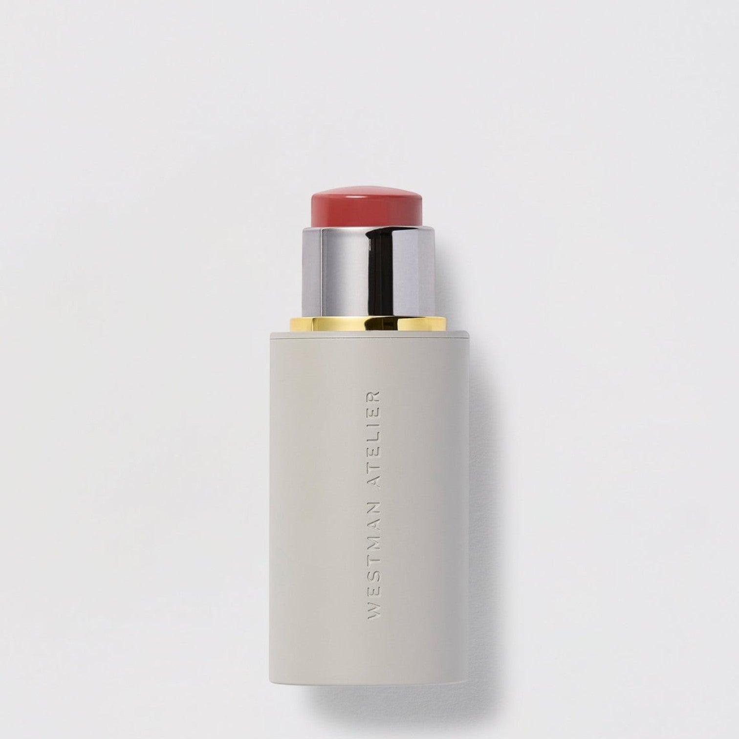 Shop Rescue Spa Baby Cheeks Blush Stick in a creamy rose shade with a sleek grey twist-up applicator tube.