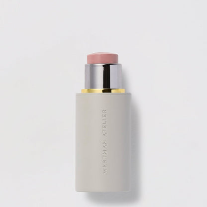 Shop Rescue Spa Baby Cheeks Blush Stick in a creamy pink shade with a sleek grey twist-up applicator tube.