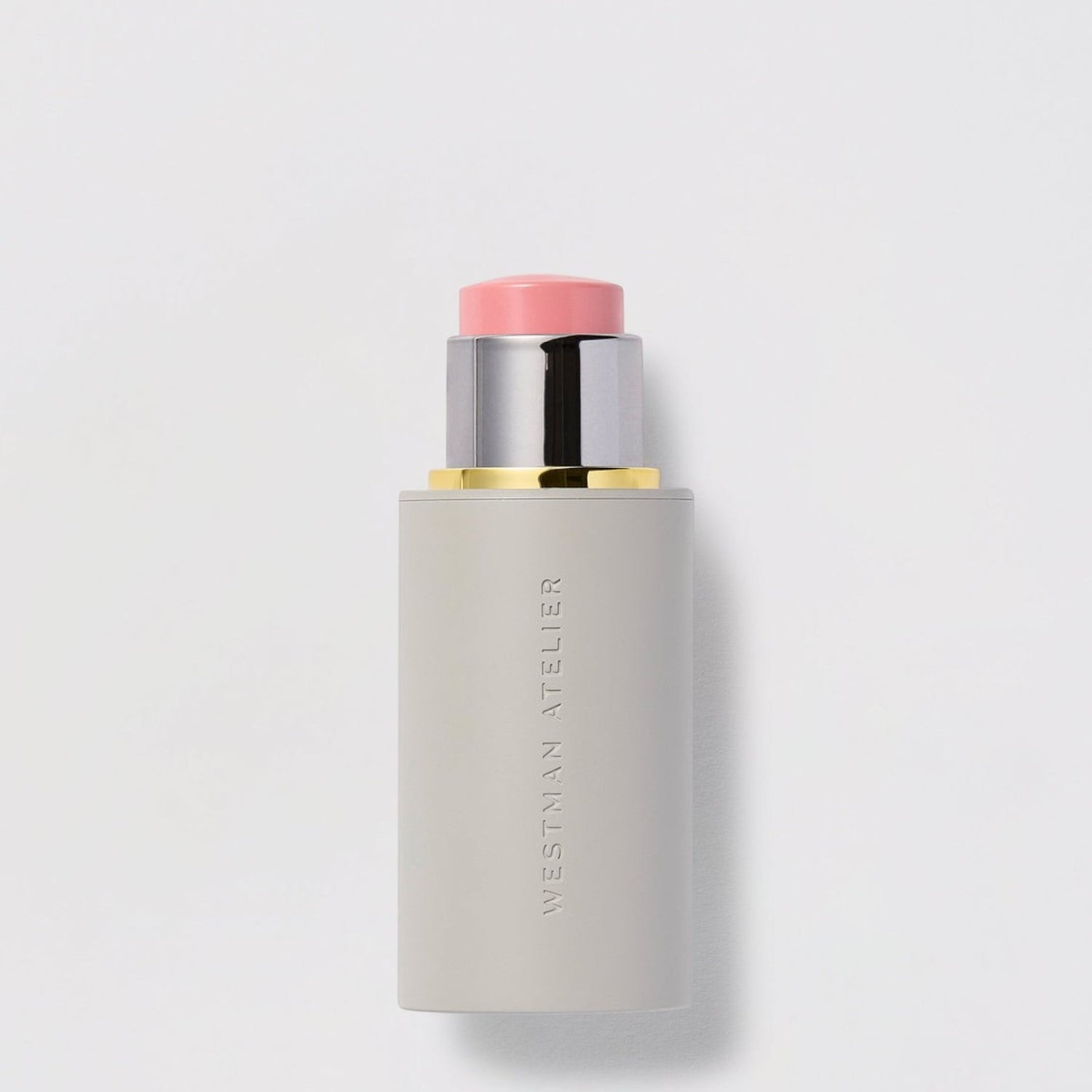 Shop Rescue Spa Baby Cheeks Blush Stick in a creamy pink shade for cheeks, lips, and lids in a sleek grey tube.