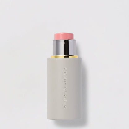 Shop Rescue Spa Baby Cheeks Blush Stick in a creamy pink shade for cheeks, lips, and lids in a sleek grey tube.