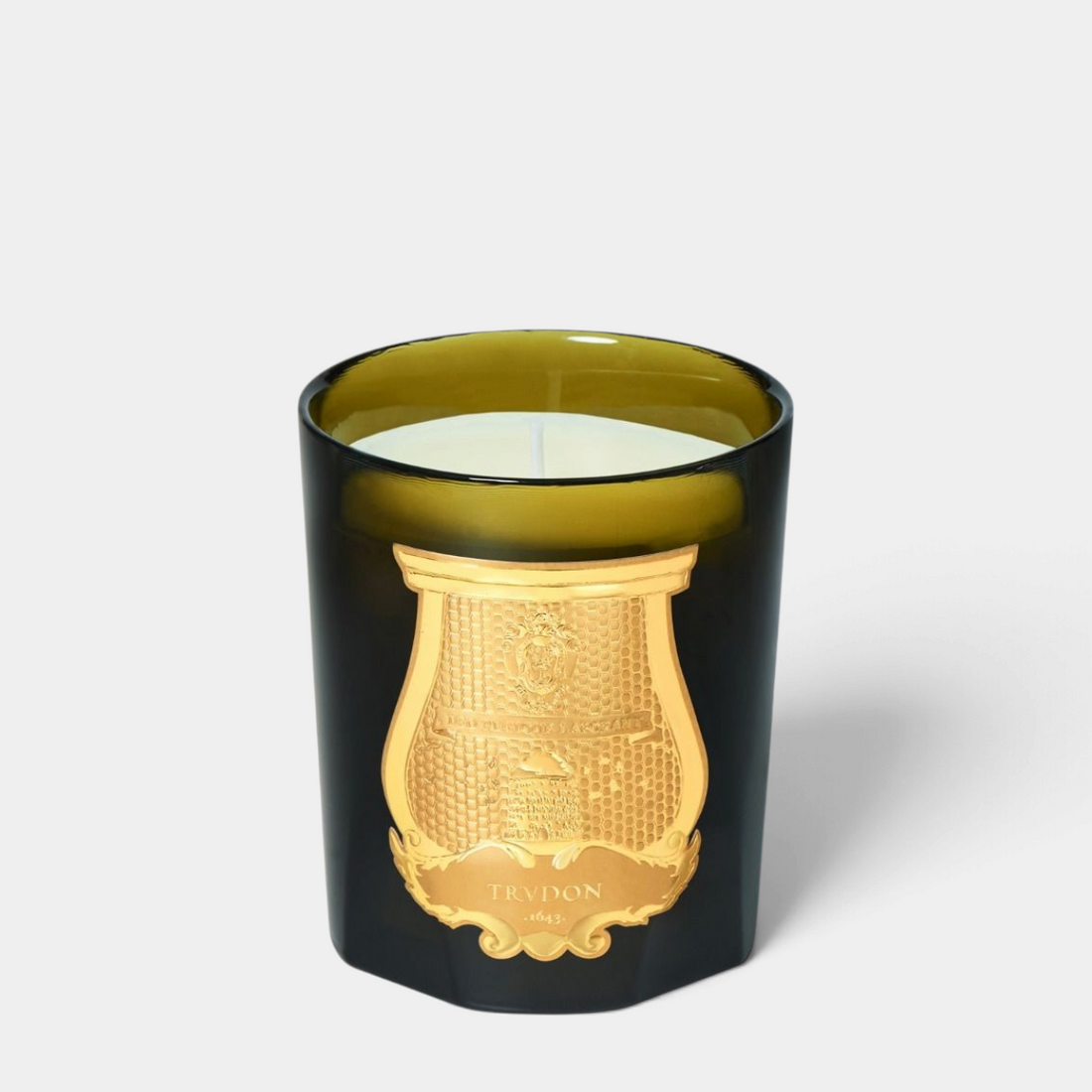 Shop Rescue Spa Balmoral classic candle in a dark green glass vessel with an ornate gold embossed label