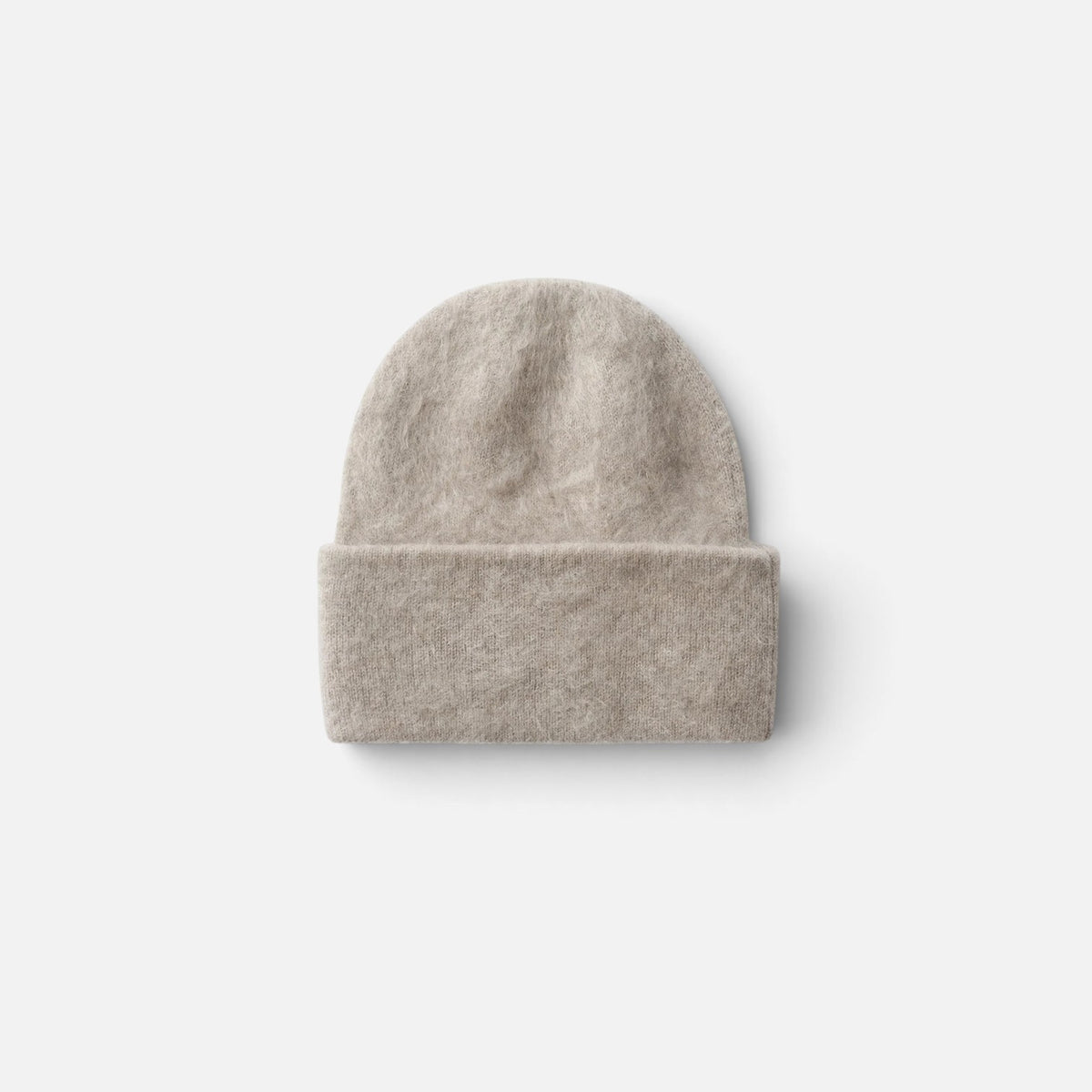 Shop Rescue Spa brushed beige cashmere beanie with a folded cuff in a soft knit texture