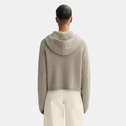 Back view of a Shop Rescue Spa chunky knit cashmere hoodie in beige, featuring a hood and ribbed hem.