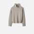Shop Rescue Spa Girlfriend Turtleneck in beige chunky knit cashmere with relaxed fit and ribbed sleeve slits