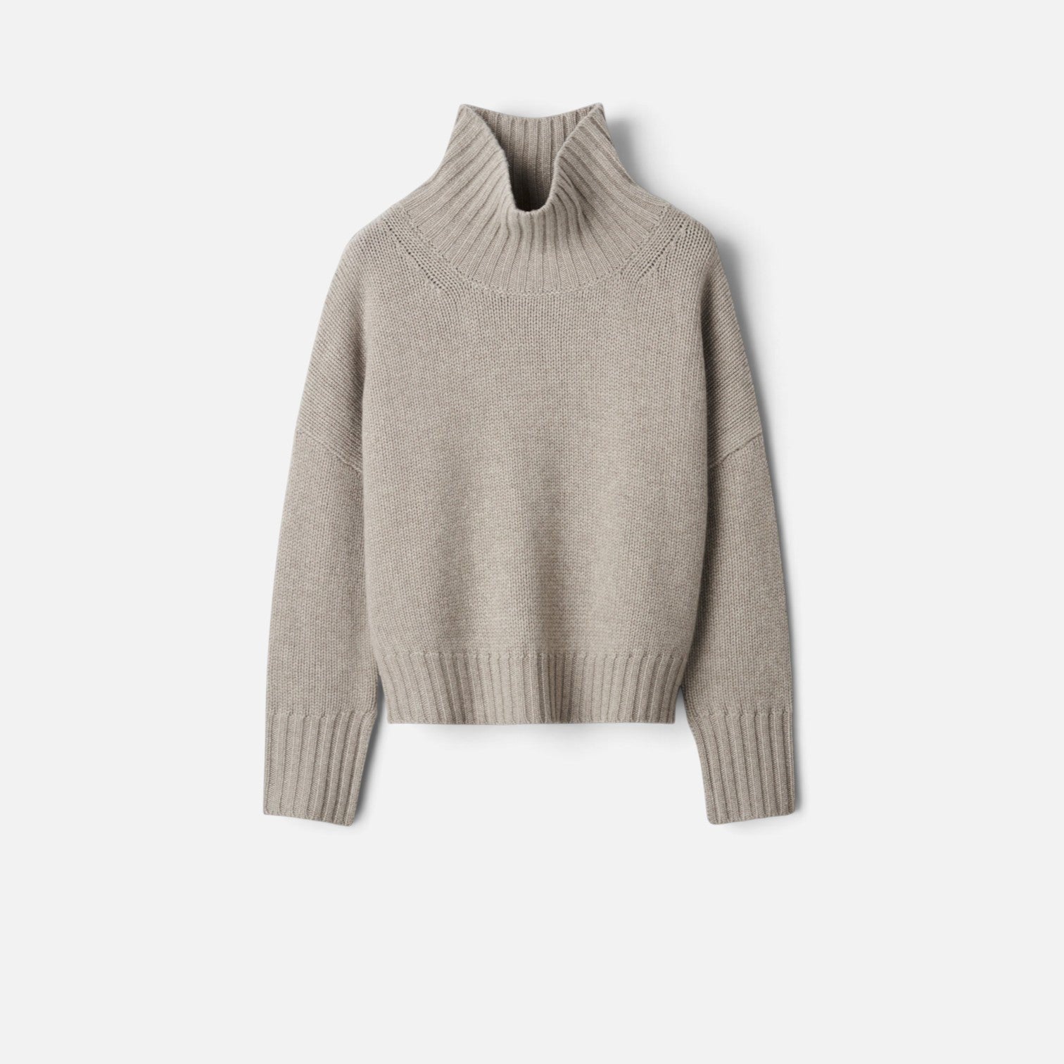 Shop Rescue Spa Girlfriend turtleneck sweater in beige chunky knit cashmere with relaxed fit and sleeve slits