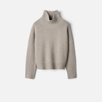 Shop Rescue Spa Girlfriend turtleneck sweater in beige chunky knit cashmere with relaxed fit and sleeve slits