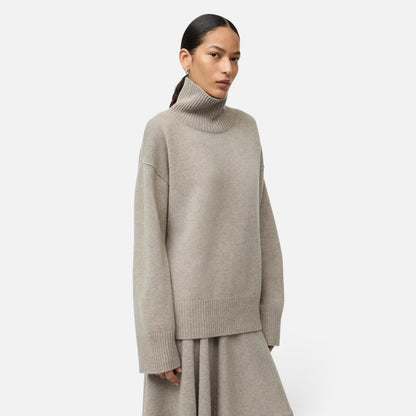 Shop Rescue Spa oversized beige cashmere turtleneck sweater with a chunky knit texture worn by a model