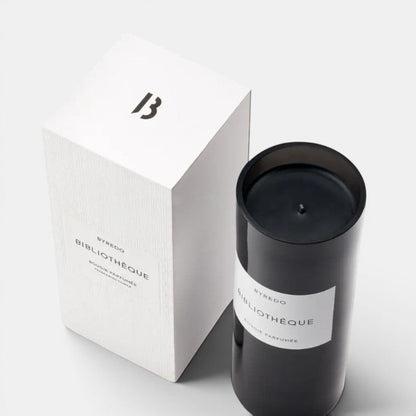 Shop Rescue Spa Bibliotheque candle in black glass with notes of peach, plum, violet, leather, patchouli, and vanilla.