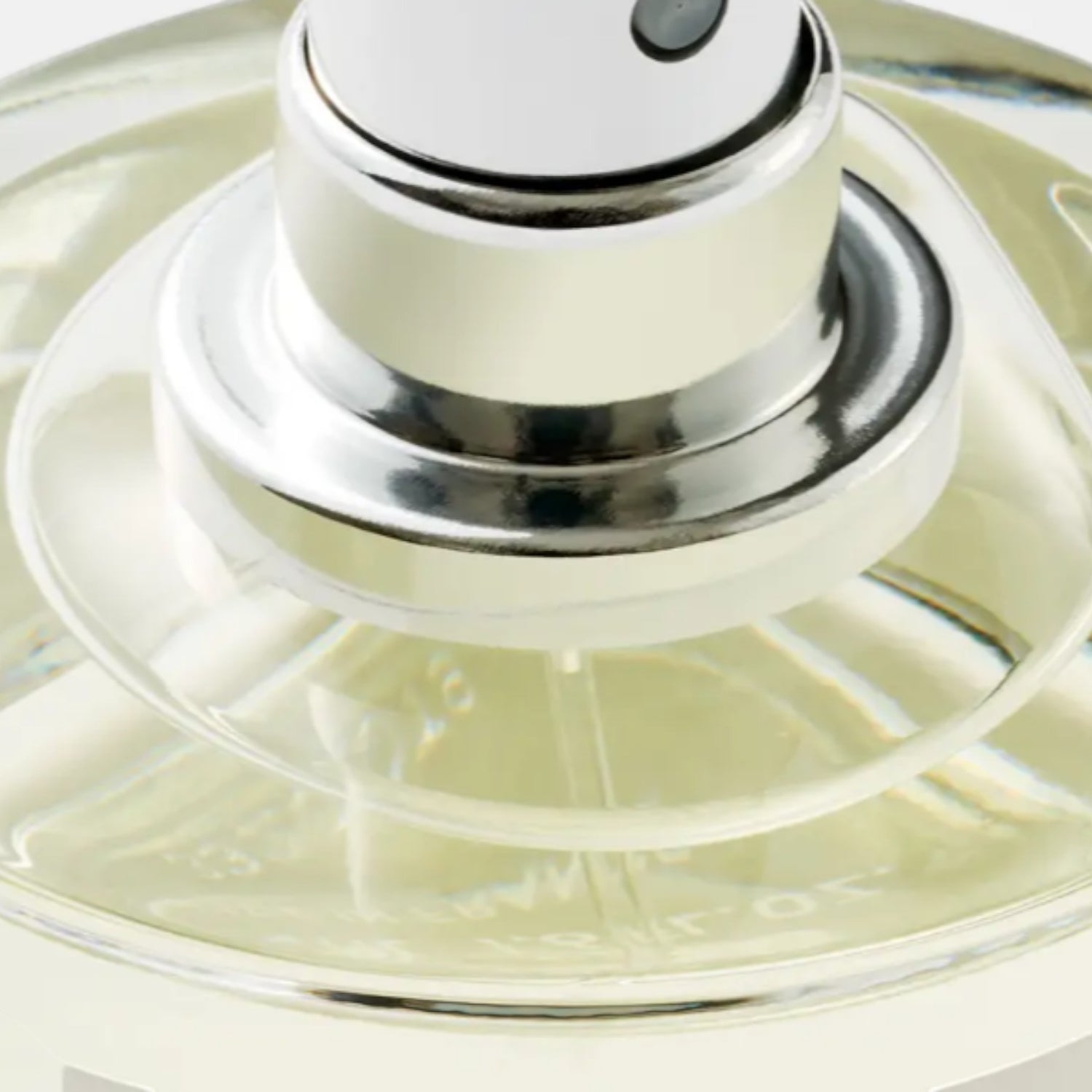 Shop Rescue Spa Bibliotheque Eau De Parfum, a clear glass bottle with silver accents and pale yellow liquid.