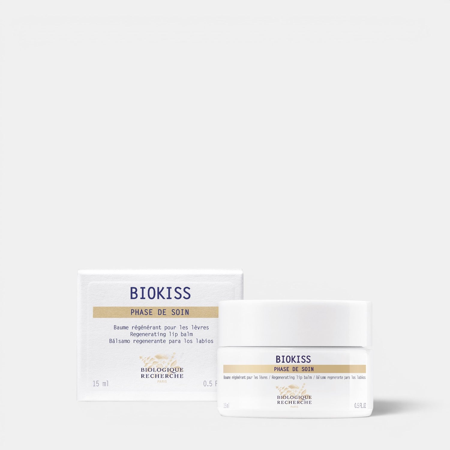 Shop Rescue Spa Biokiss regenerating lip balm in a white jar and matching box with plant-based moisturizing formula.