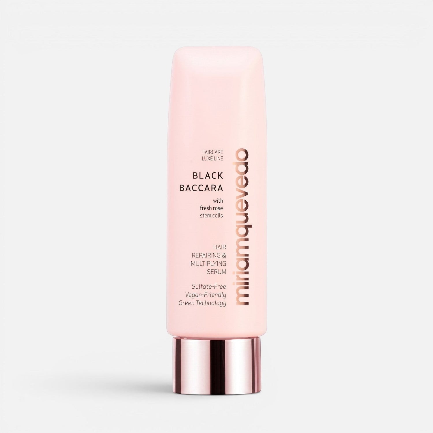 Shop Rescue Spa Black Baccara hair repairing and multiplying serum in a light pink squeeze tube with metallic cap.