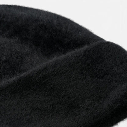 Shop Rescue Spa black brushed 100% cashmere knit beanie with a soft, fuzzy texture.