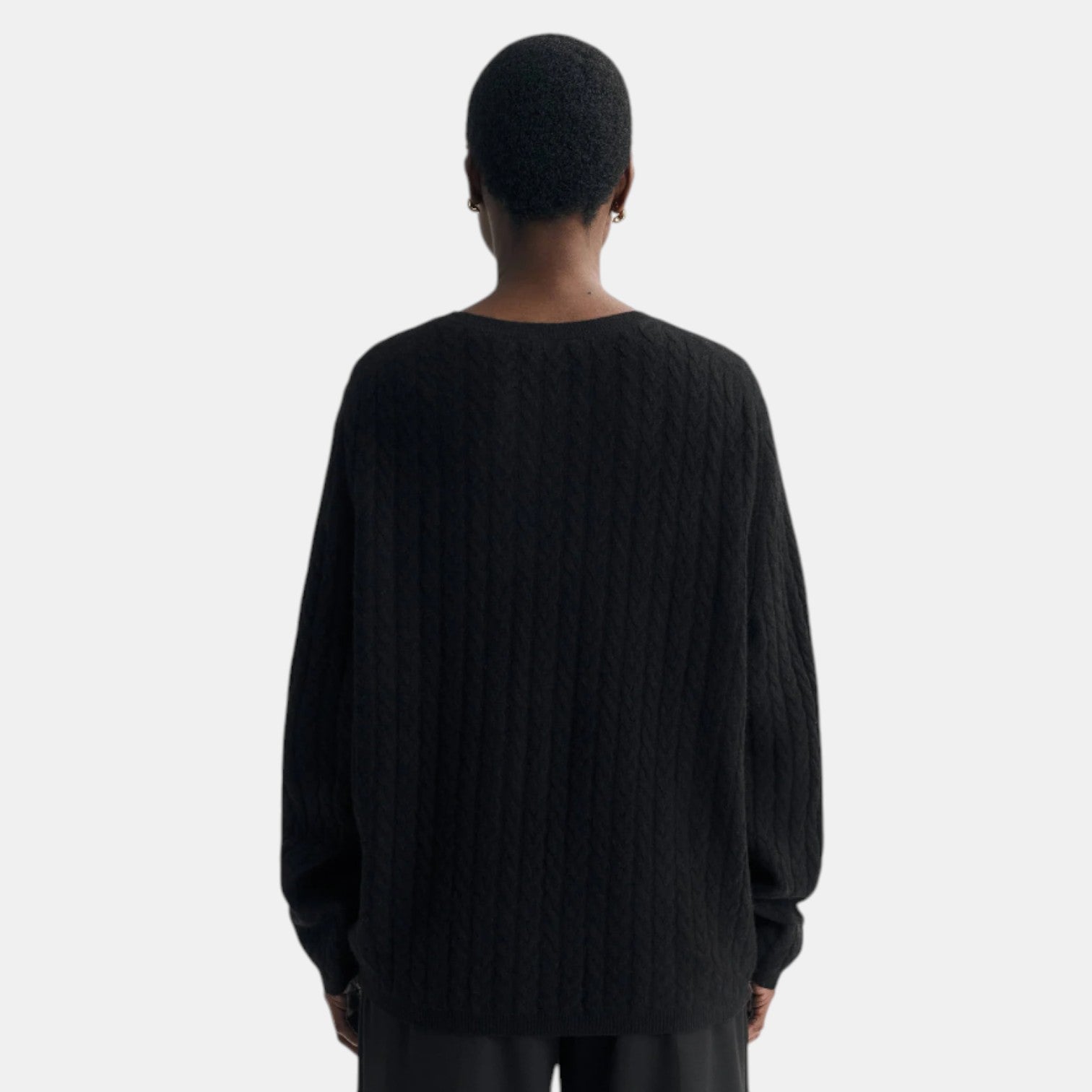 Shop Rescue Spa oversized black cable knit cashmere sweater worn by a model, back view