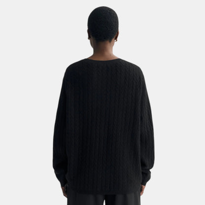Shop Rescue Spa oversized black cable knit cashmere sweater worn by a model, back view
