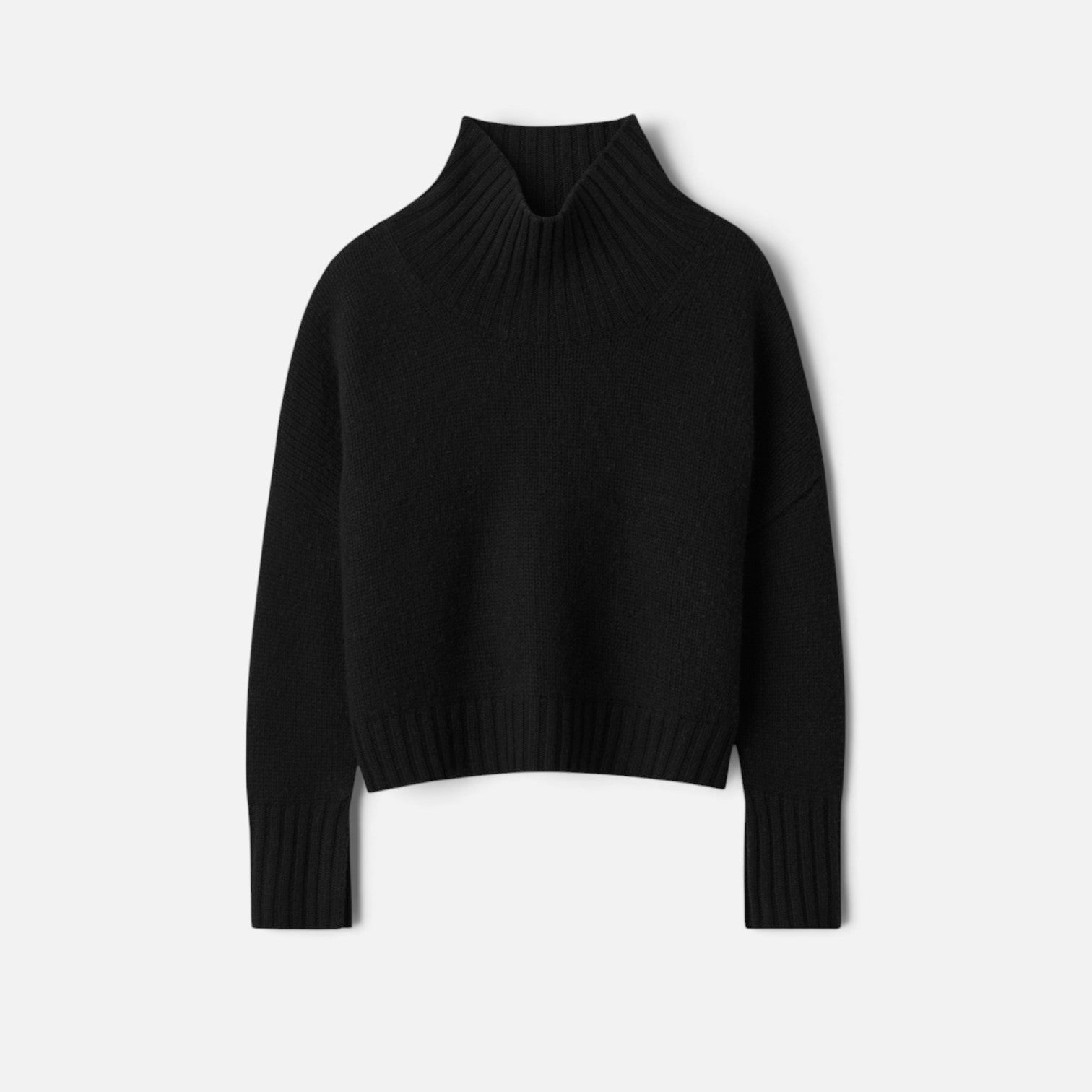 Shop Rescue Spa black chunky knit cashmere turtleneck sweater with sleeve slits in a relaxed fit