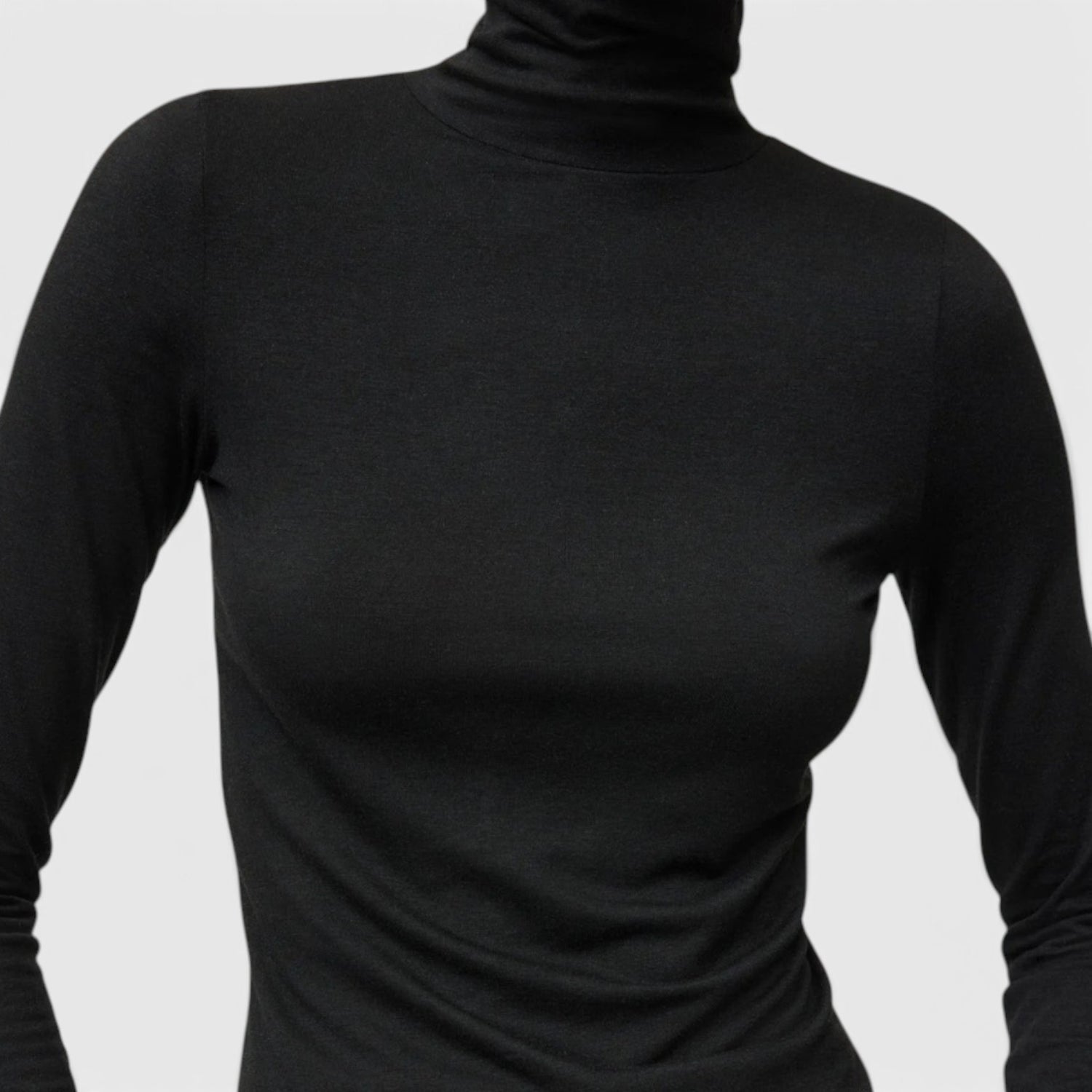 Shop Rescue Spa lightweight black jersey turtleneck made from a soft Tencel and cashmere blend.