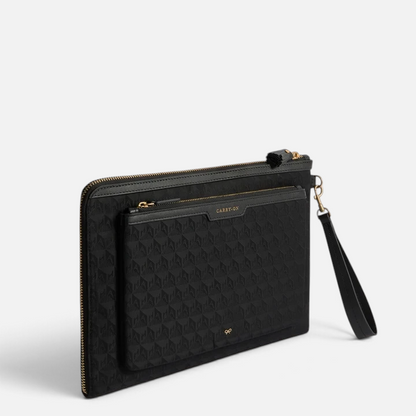 Shop Rescue Spa black nylon Logo Journey Essentials pochette with gold zip, wrist strap, and labelled exterior pockets.